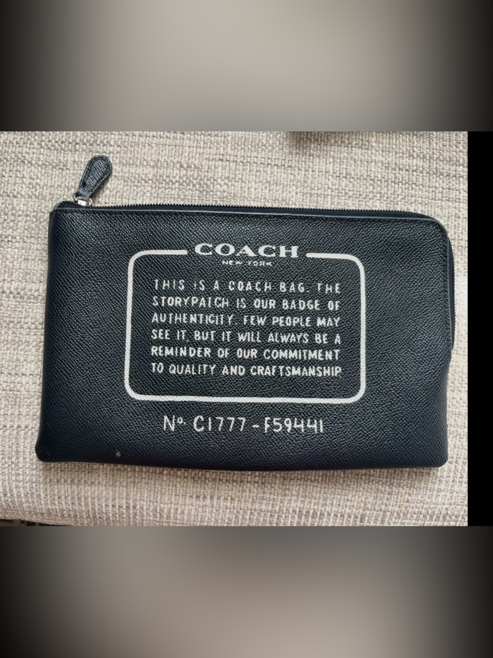 COACH Black Leather Zip Pouch with White Print story patch